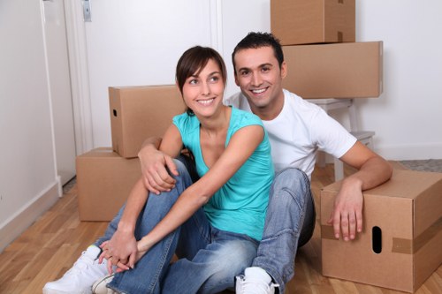 Professional movers handling furniture in Shepherd's Bush